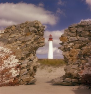 Photo by Vincent T. Marchese The present lighthouse appears from behind the remains of the 1847 lighthouse. Photograph taken during the mid-70s by Vincent T. Marchese. Click for full image.