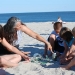 Anita Roth shows sea glass to children