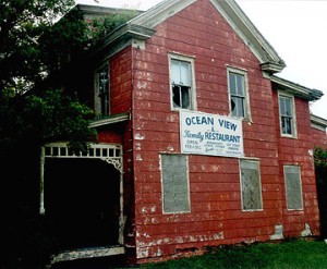 OldSawyerSign Wear and decay from years of neglect are as obvious on the outside as they are on the inside of the circa 1859 Sawyer homestead.