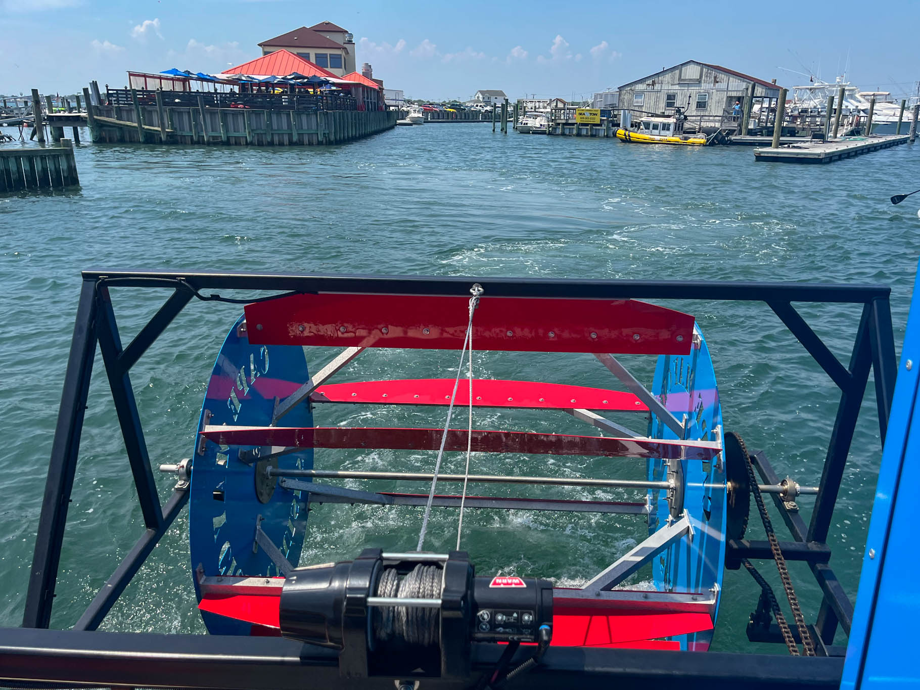 Looking at the dock and wheel spins as you paddle the Cape May Cycle Cruises boat.