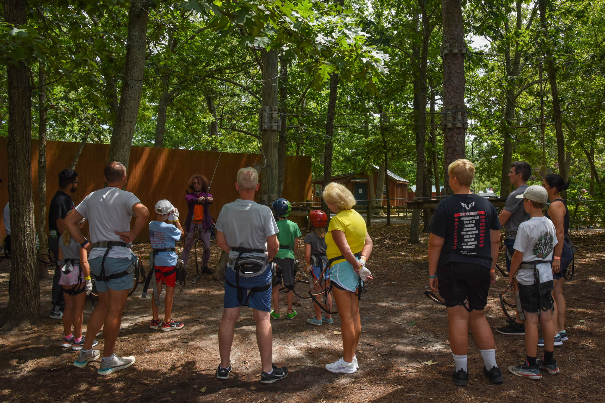 Everyone learning how to use the equipment at Tree to Tree.