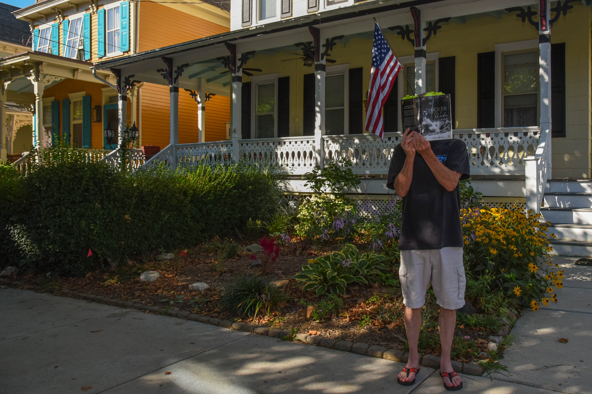 Standing on Decatur Street reading "Thicker Than Water"
