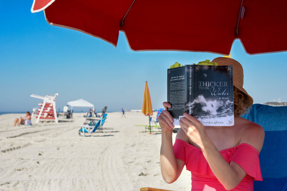 Reading on the beach in front of Congress Hall.