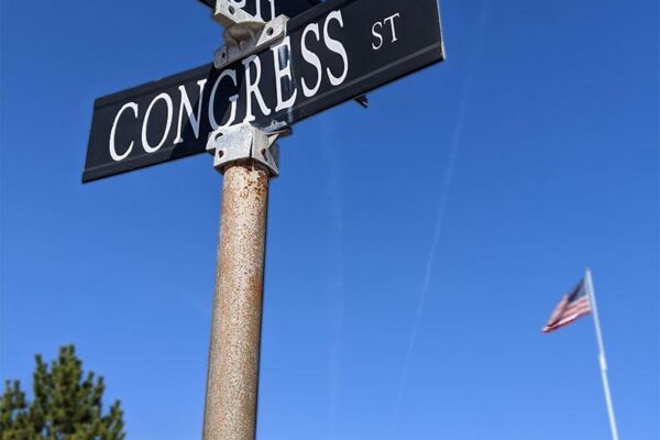Street signs at Beach and Congress