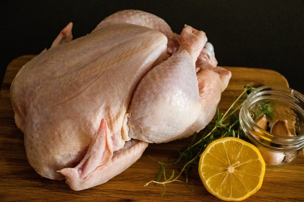 Raw chicken, garlic, lemon, and rosemary