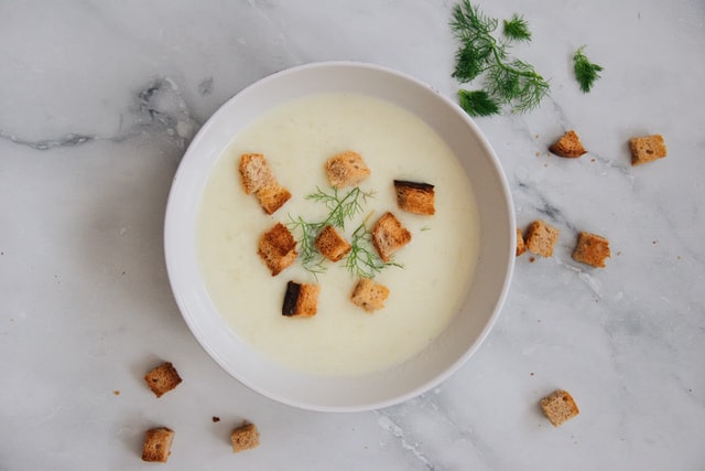 Flat shot of soup with croutons