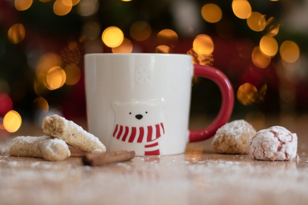 A mug and holiday cookies