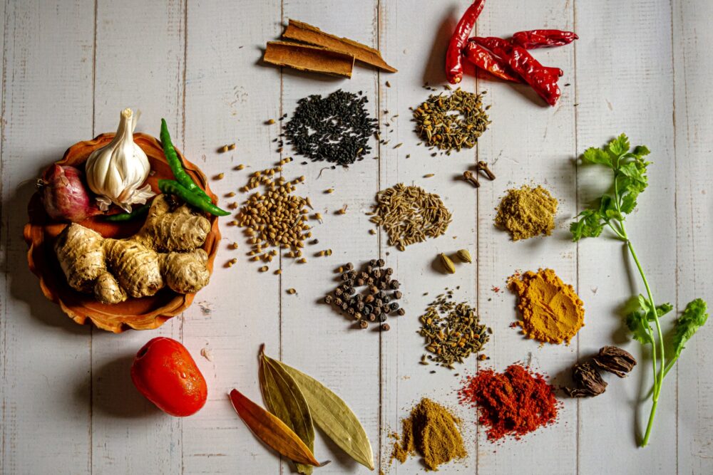 Spices laid out on a white background