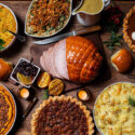 Flat spread of a Thanksgiving table laid with food