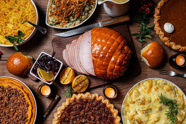 Flat spread of a Thanksgiving table laid with food