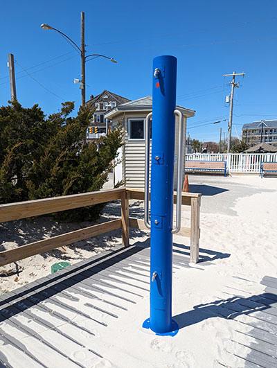 vertical blue shower at the beach entrance