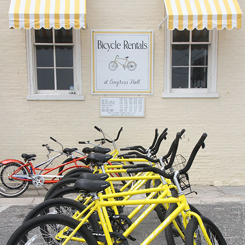 yellow bicycles outside of a Cape May bike rental shop