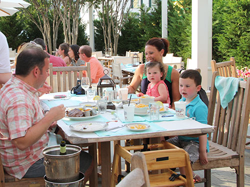 A family eating outdoors