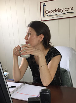 Jessica with tea at her desk in Cape May