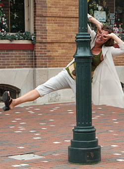 Kathleen posing with a lamp post