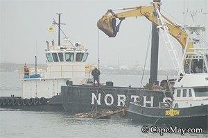 The North Star removes an abanboned sailboat