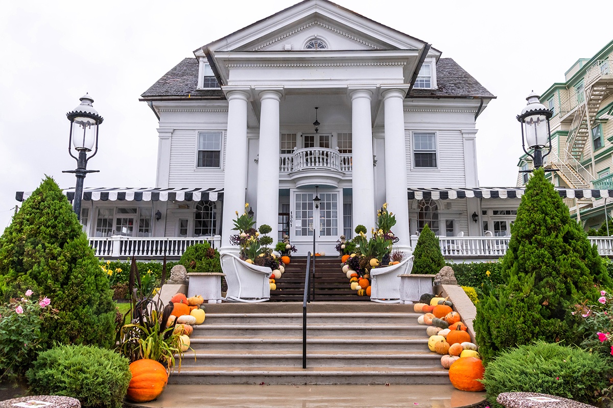 Pumpkins leading up a staircase to Peter Sheilds Inn