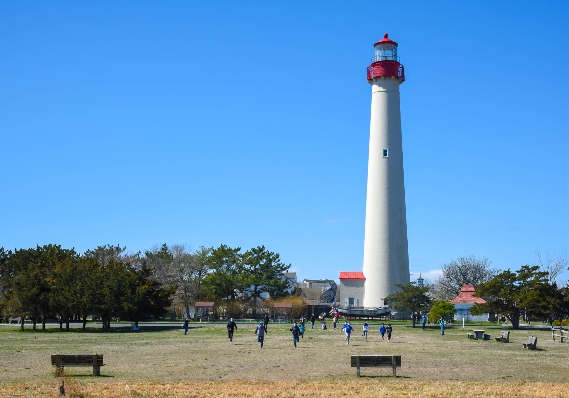 AT the Lighthouse kids running in the field.