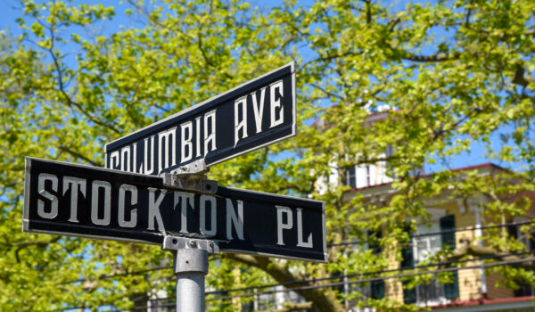 Stockton on the corner of Place & Columbia Avenue looking at the street signs