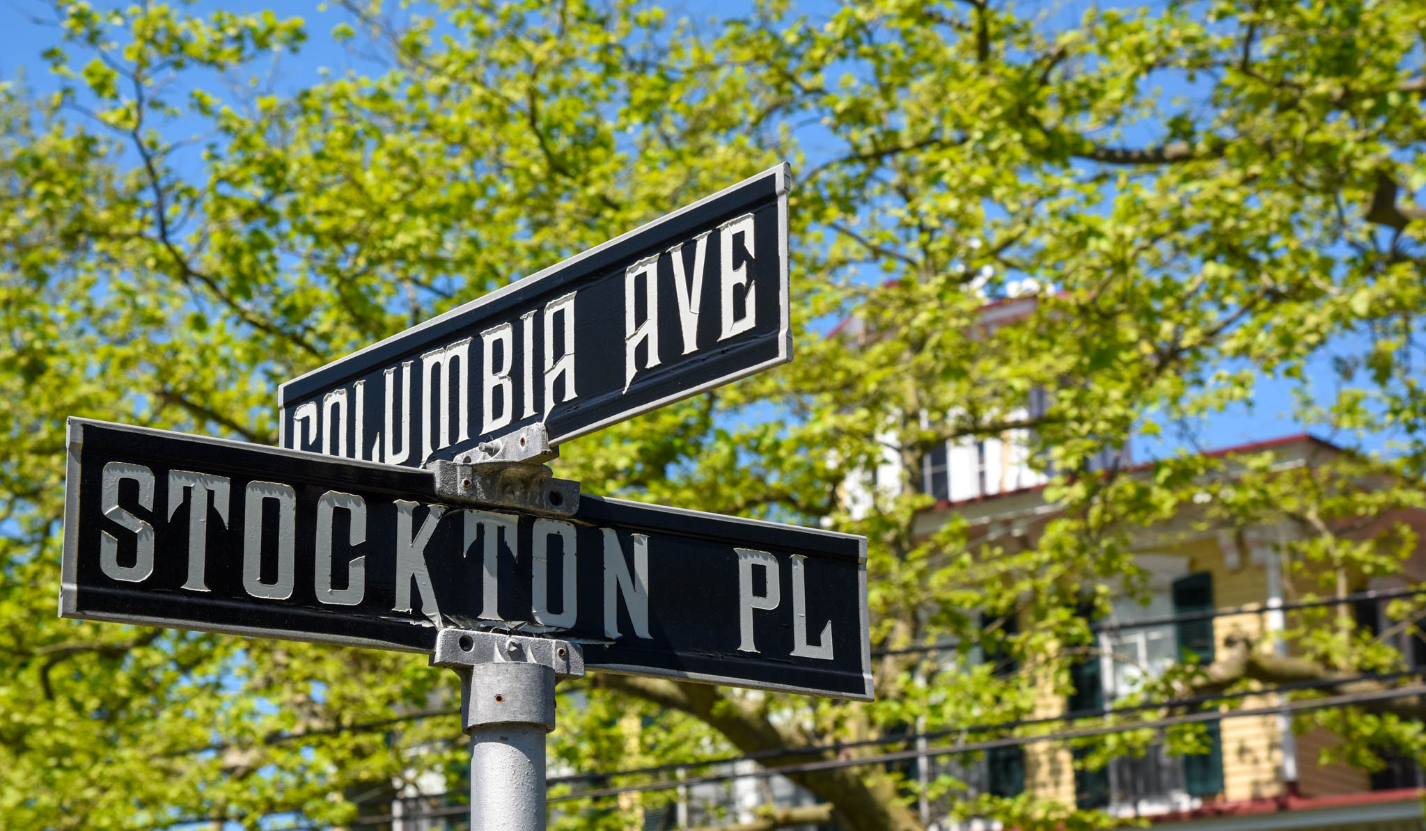 Stockton on the corner of Place & Columbia Avenue looking at the street signs