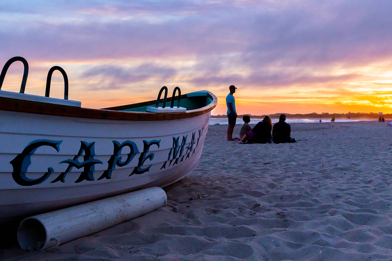 Close up view of a Cape May lifeguard boat with a colorful sunset in the background