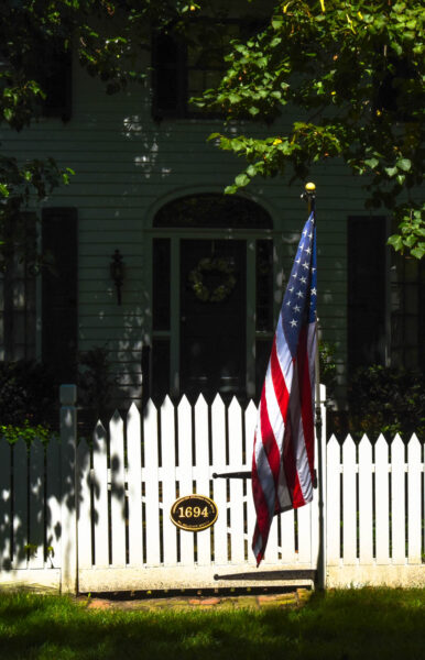 Sunny With A little Shade showing the American Flag on a fence in West Cape May