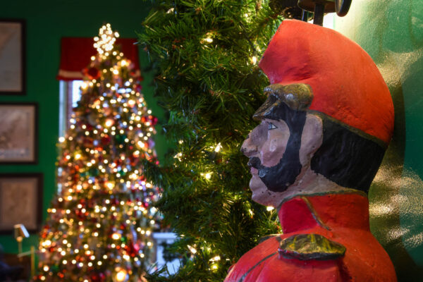 statue Standing Guard at Congress Hall's Christmas tree indoors