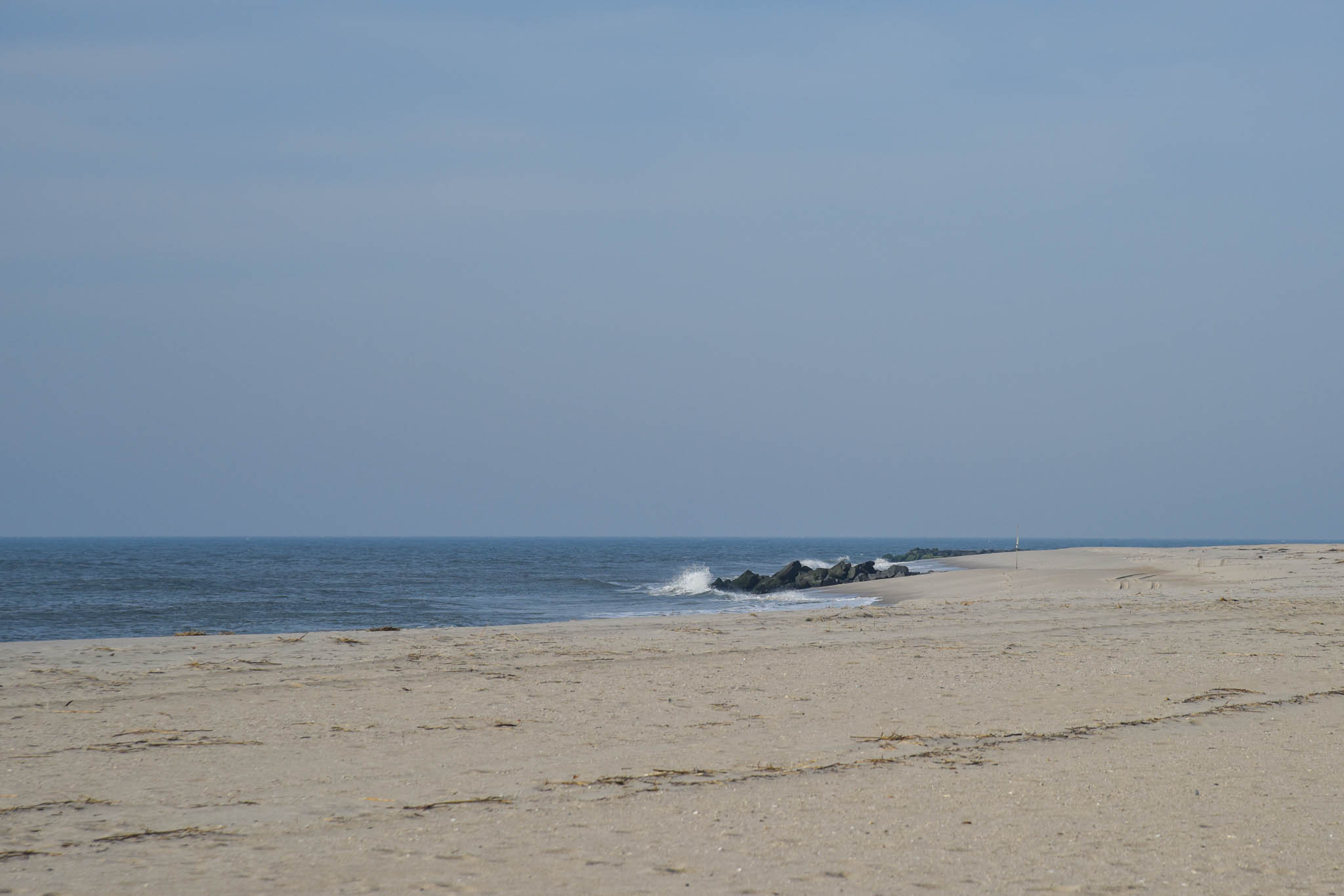 Looking at the ocean standing on the beach