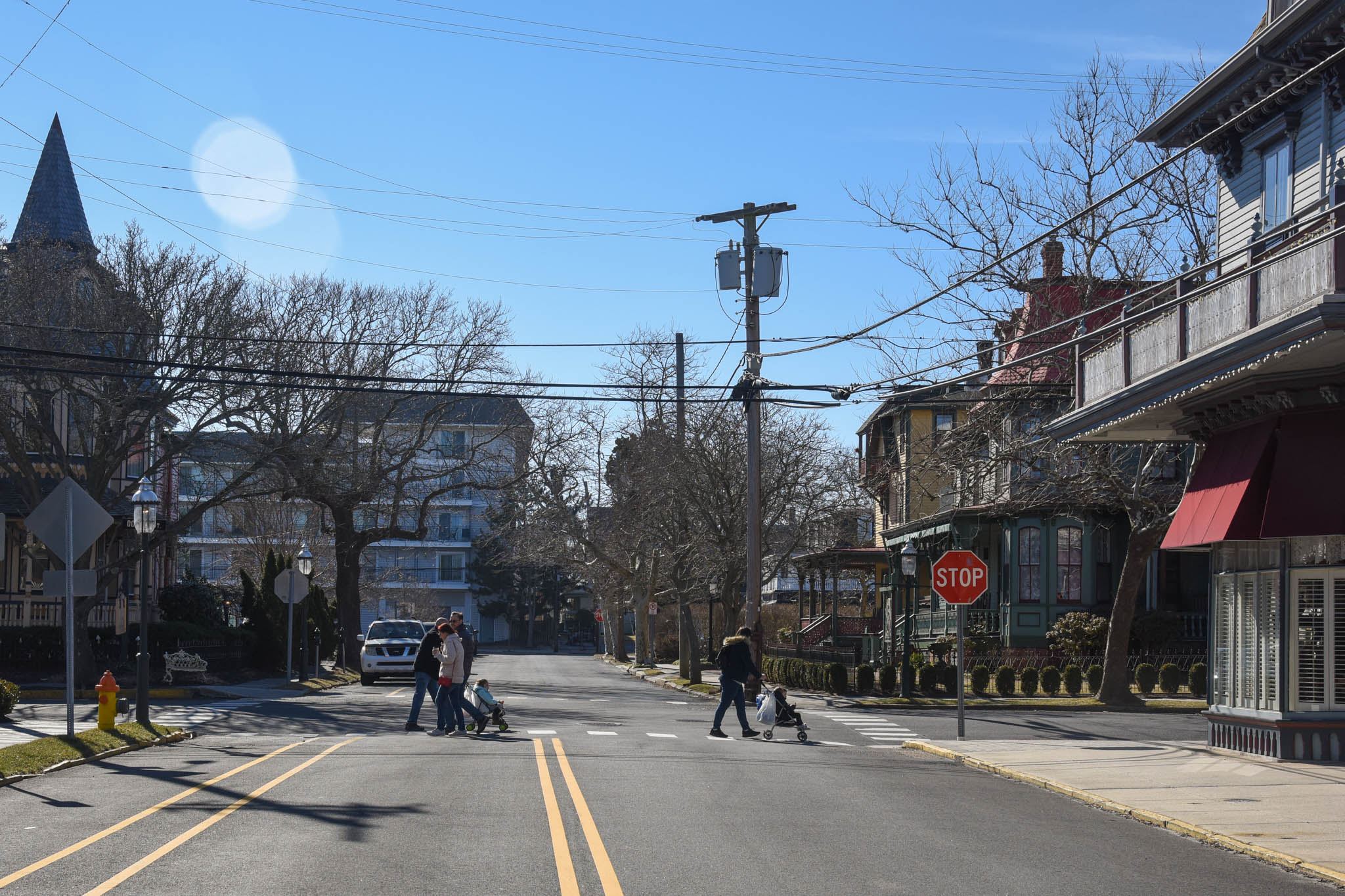 standing in the middle of Columbia Ave watching people walking around town