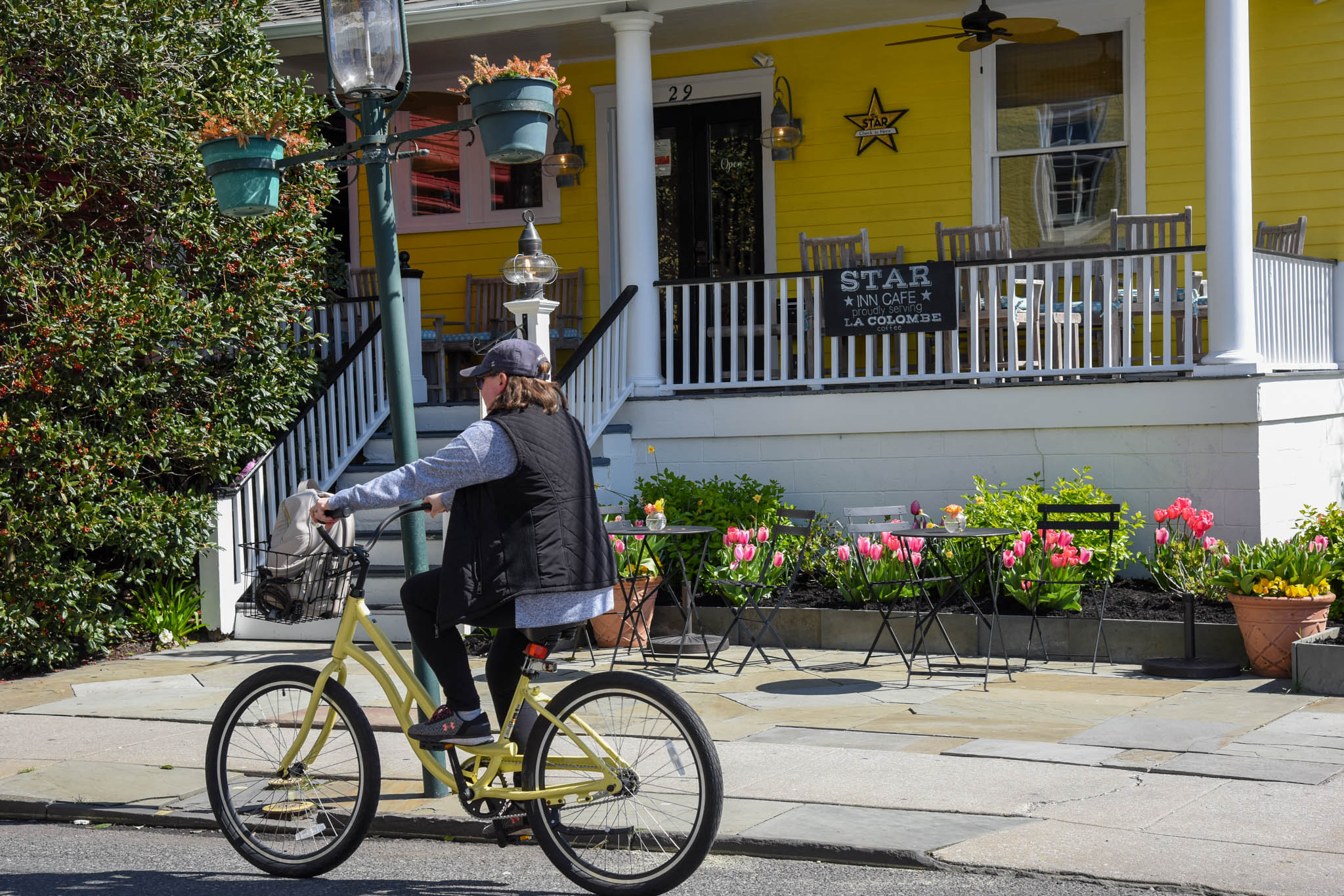 A woman riding a bicycle on a Spring Day