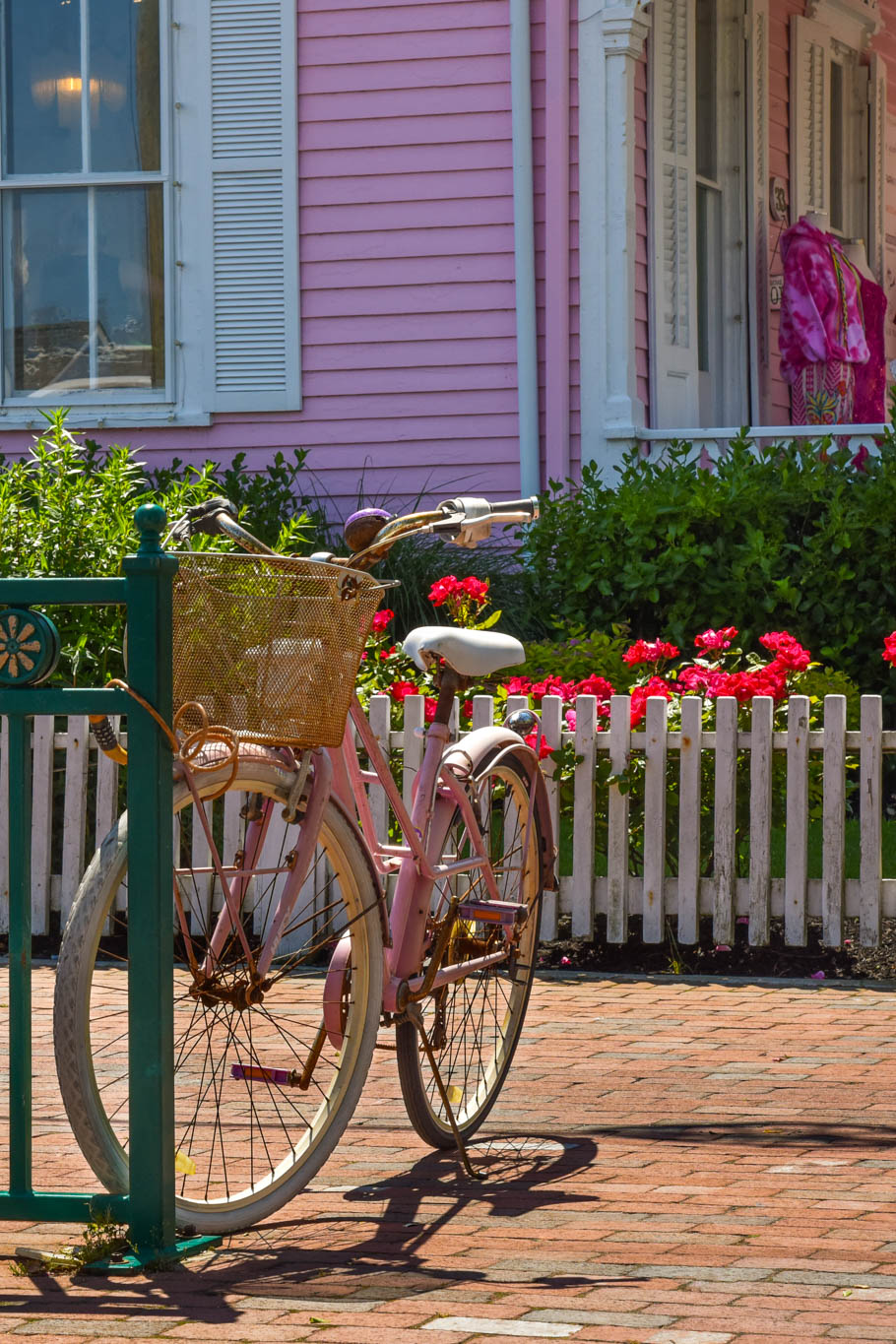 Pink bike parked next to The Pink House.