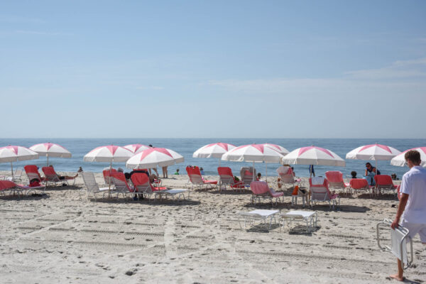 On the Beach where they are setting up for the day.