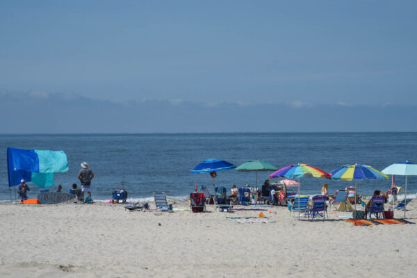 people at the Cove Beach looking at Delaware