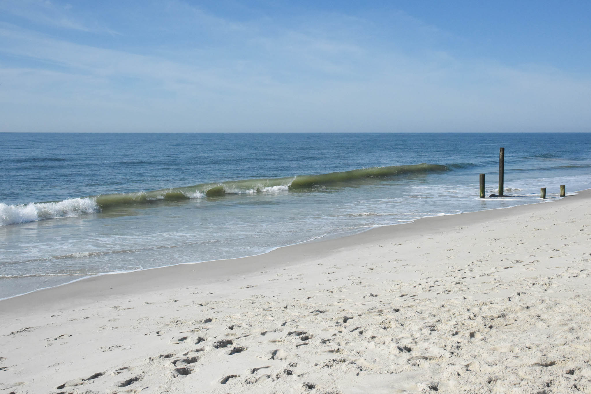 on the beach looking at the waves of the ocean