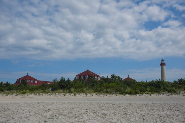 Sunny View of the Cape May Light house and St. Mary's by the Sea