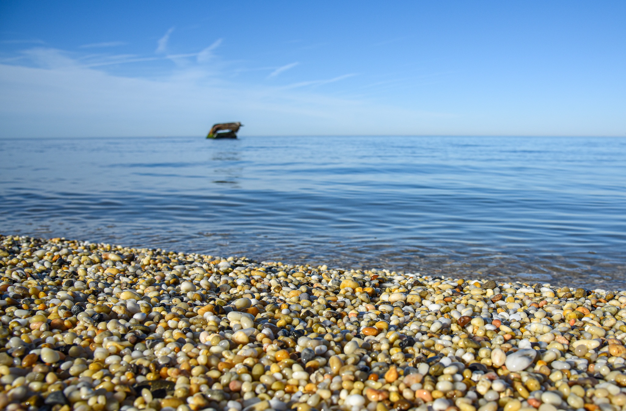 At Sunset Beach looking for Cape May Diamonds with the SS Atlantus in the background