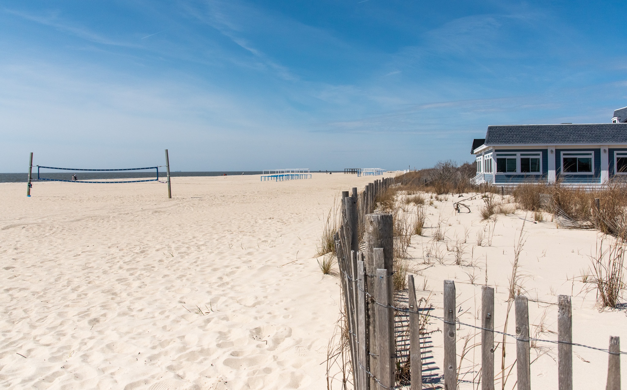 At the beach on a beautiful day next to the dunes