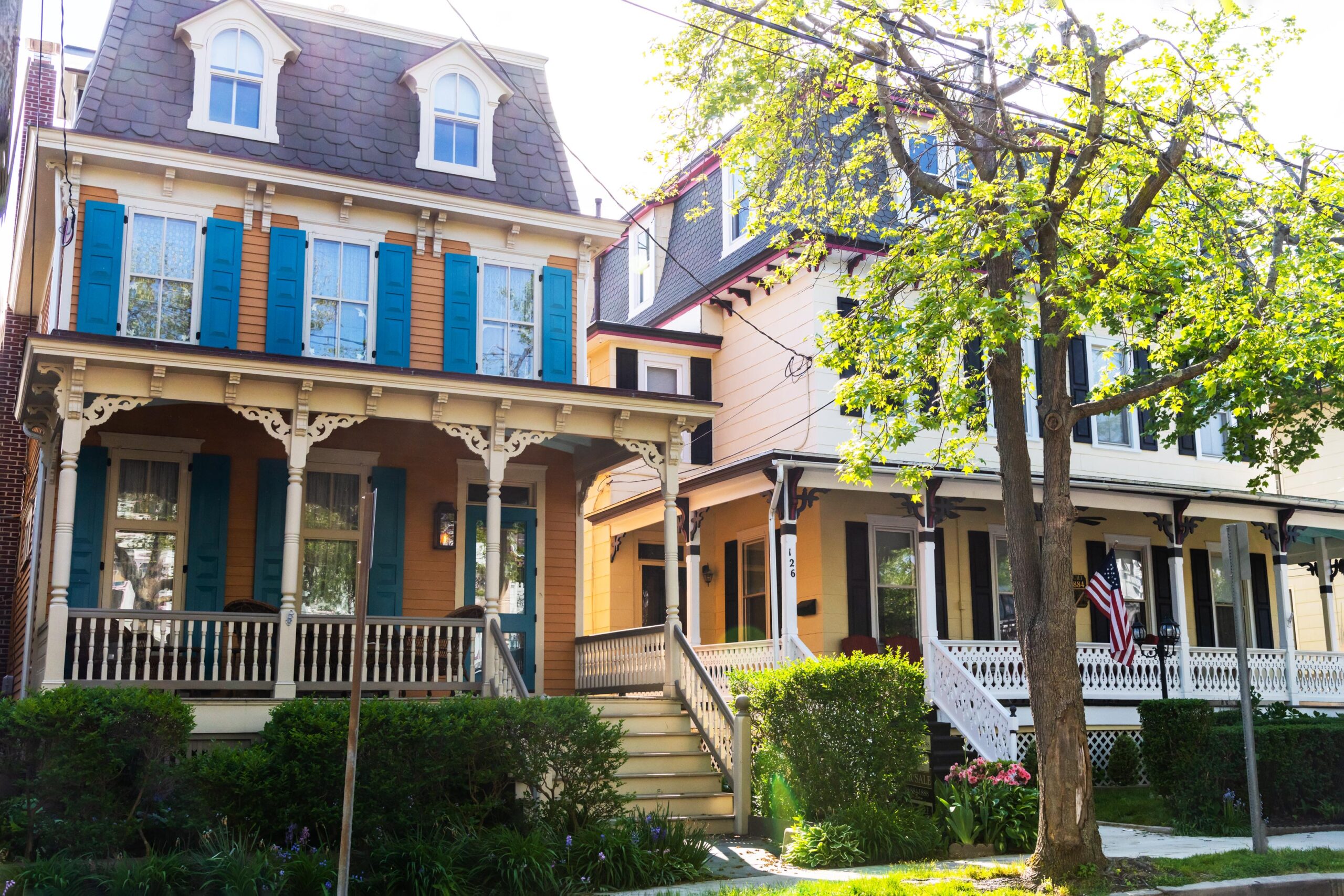 The sun shining on two Victorian homes