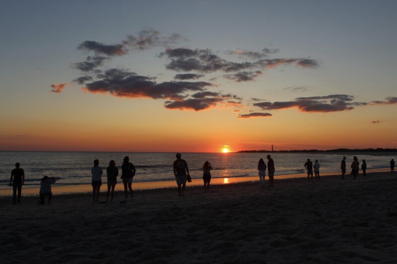 People watching the sunset at The Cove beach in Cape May