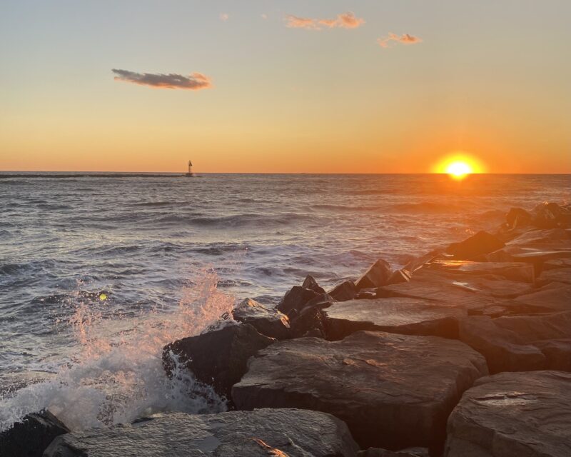 sunset at the jetty over the delaware bay