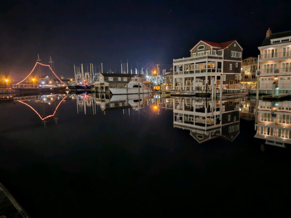 The fishing boats and homes on the Cape May Harbor