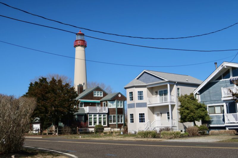 On the street in Cape May Point with the lighthouse in the background