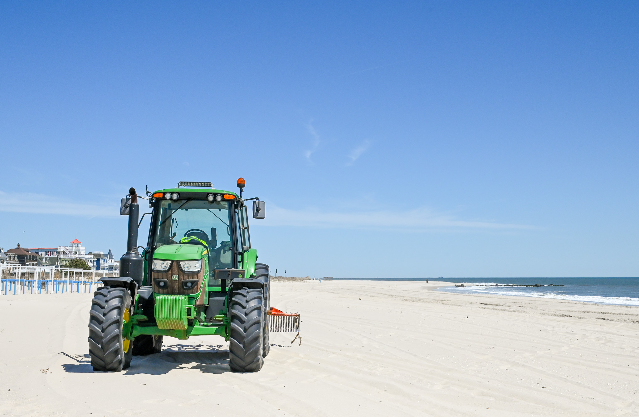 Tractors Are On The Beach by Convention Hall