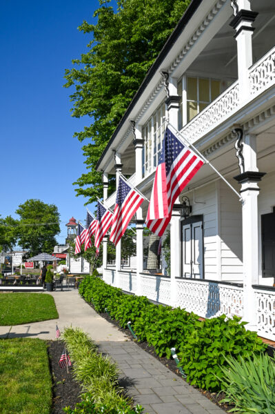 The American Flags Flutter Gently in the Light Breeze at Elaine's