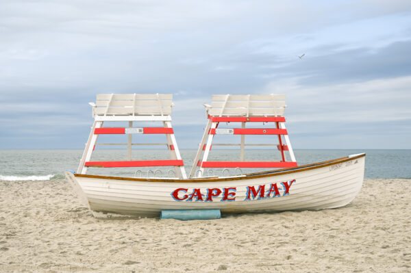 The Cove with two lifeguard stands and a lifeguard boat.