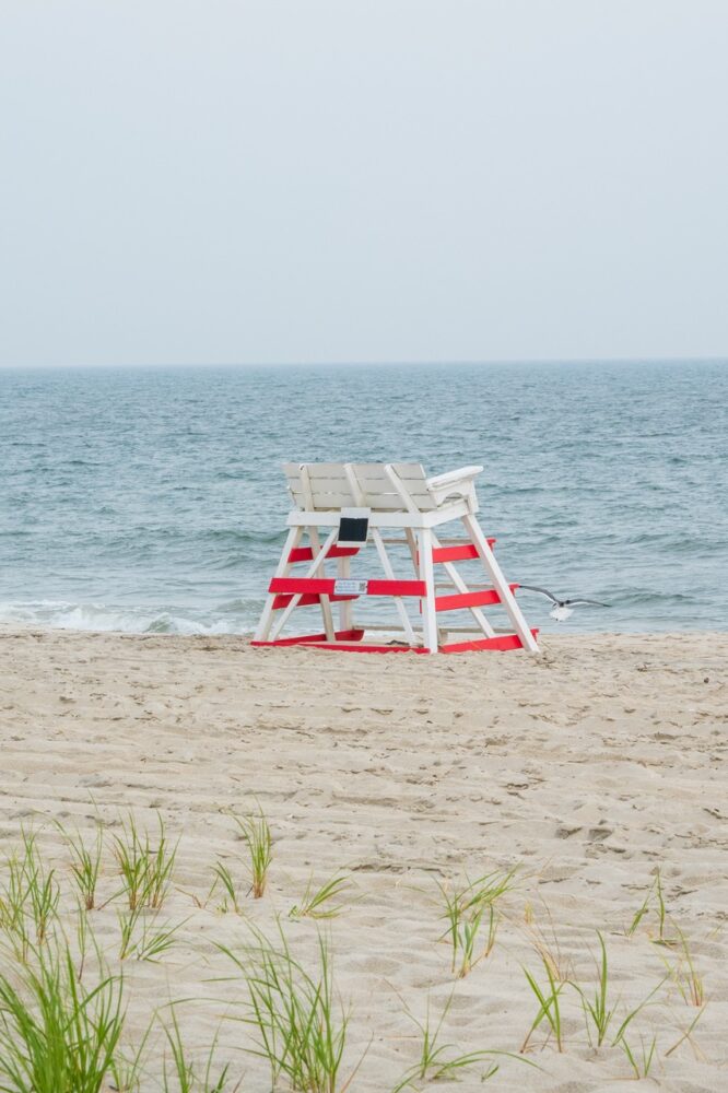 Peaceful view of a lifeguard stand with a seagull on the beach in Cape May NJ