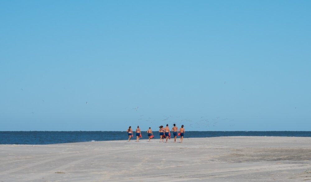 Cape May Point Lifeguards running before their morning shifts starts.